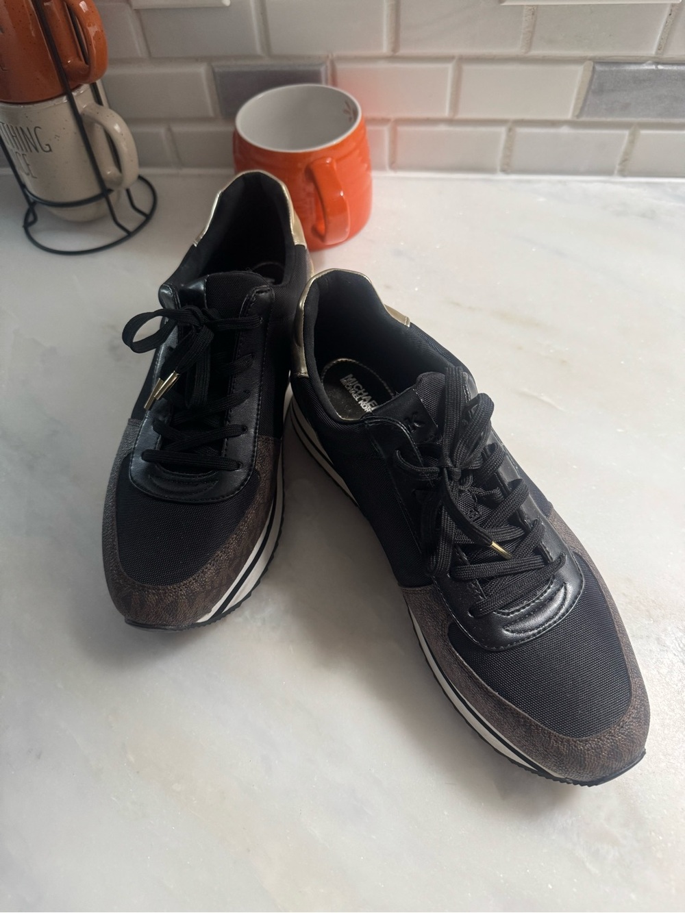 Ladies Michael Kors Black Casual Athletic Sneakers with Brown Accents